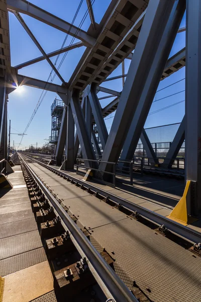 Modern railway steel bridge over highway — Stock Photo, Image