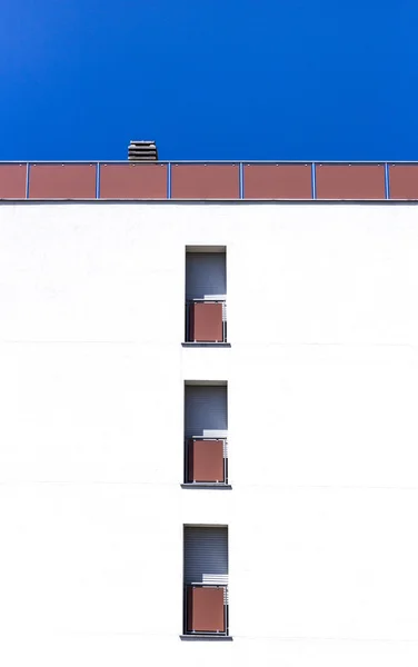 Facade of a modern building with three windows — Stock Photo, Image