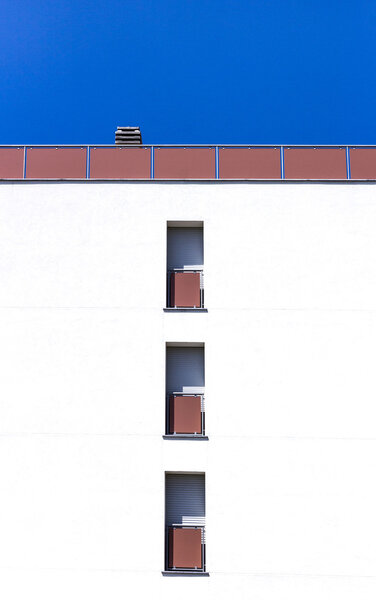 Facade of a modern building with three windows