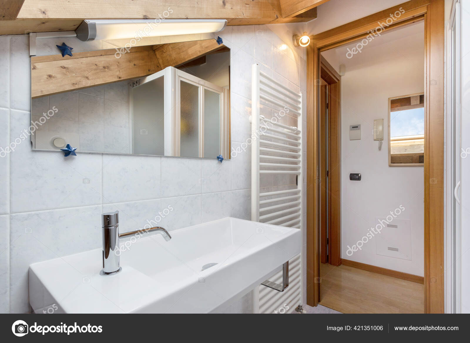 Cozy Bathroom Towel Radiator Toilet Sink Roof Exposed Stock Photo by ©germanopoli
