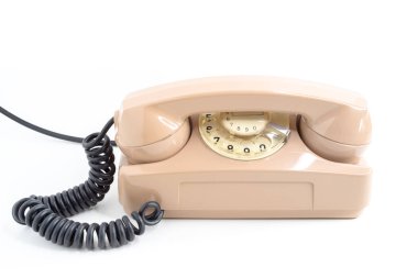 Antika telefon. Pembe eski telefon beyaz arkaplanda izole edildi.