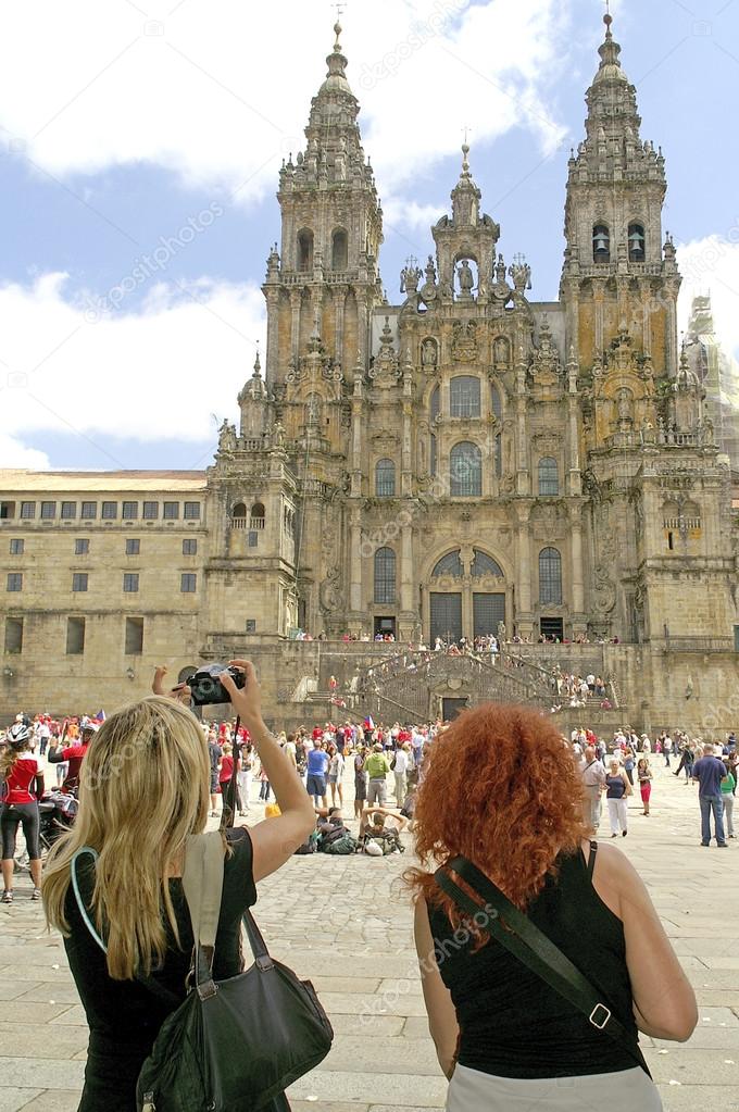 Tourists photographing the facade of the Cathedral of Santiago de Compostela