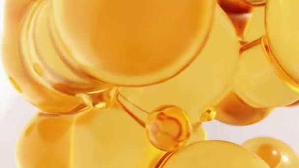 Olie geel oranje abstracte achtergrond met ronde gouden bollen close-up — Stockvideo