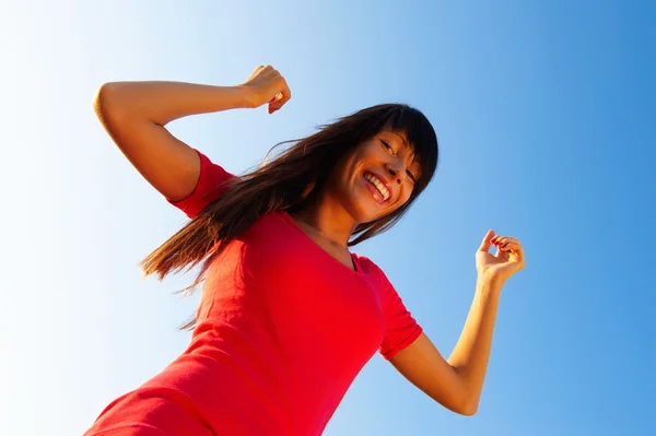 Young woman with raised arms — Stock Photo, Image