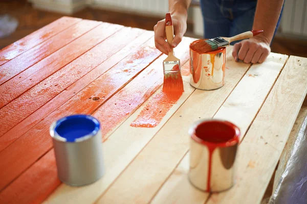 Man painting furniture