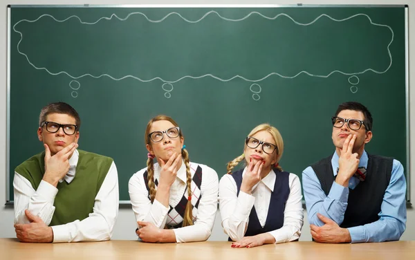 Four nerds thinking — Stock Photo, Image