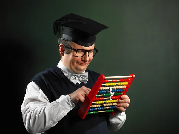 Manliga nörd anläggning abacus — Stockfoto