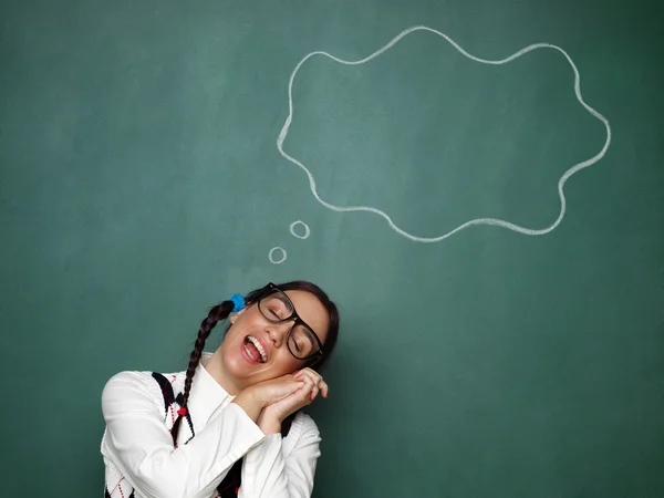 Young female nerd daydreaming — Stock Photo, Image