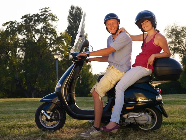 Young man and woman on motorcycle — Stock Photo, Image