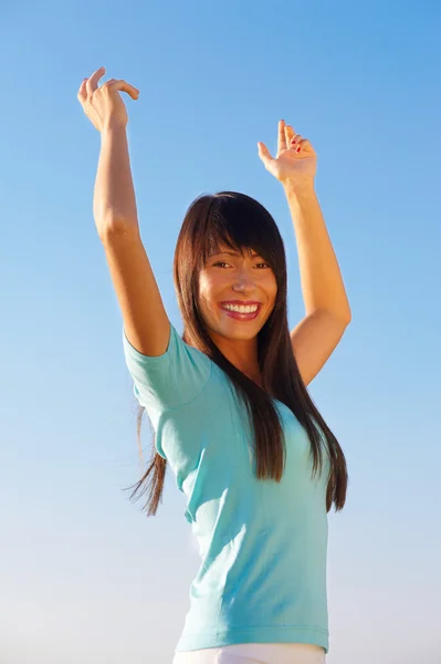 Young woman with raised arms — Stock Photo, Image