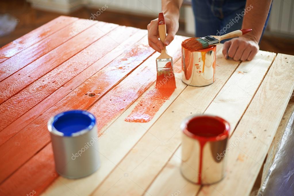 Man painting furniture