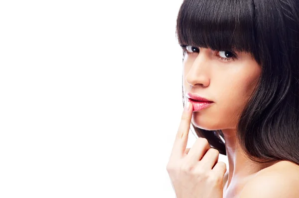 Mujer con el dedo en los labios — Foto de Stock