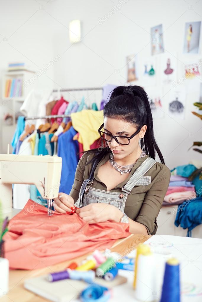 Designer working on sewing machine