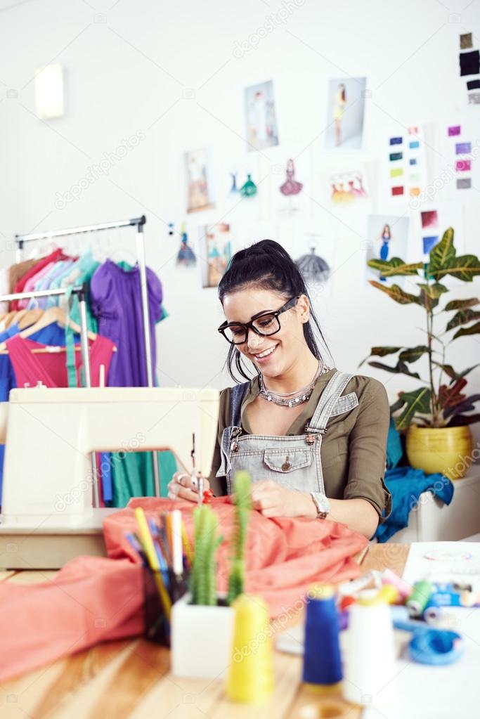 Designer working on sewing machine