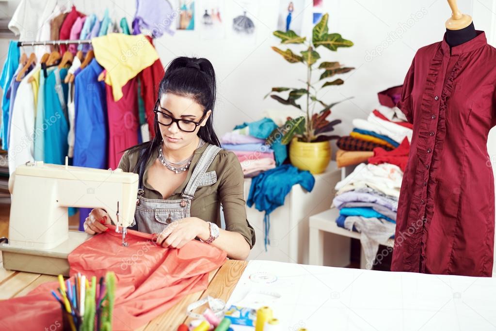 Designer working on sewing machine