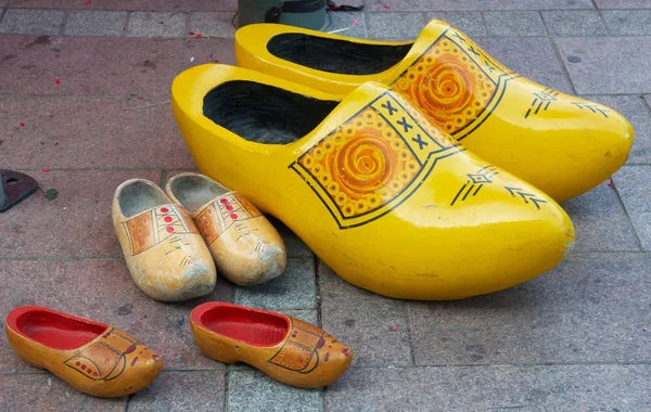 Three pairs of different size clogs — Stock Photo, Image