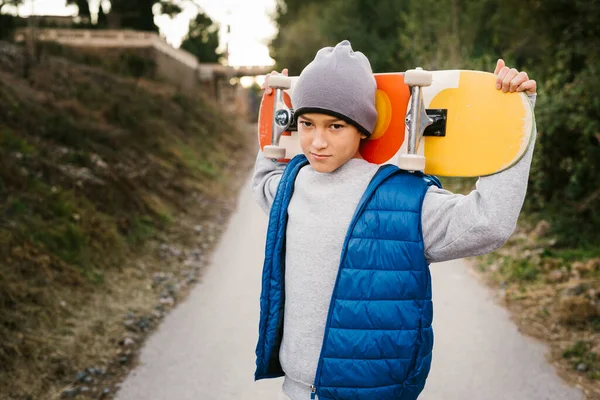 Portrait Teen Boy Holding His Skateboard His Shoulder Path — Stock Photo, Image