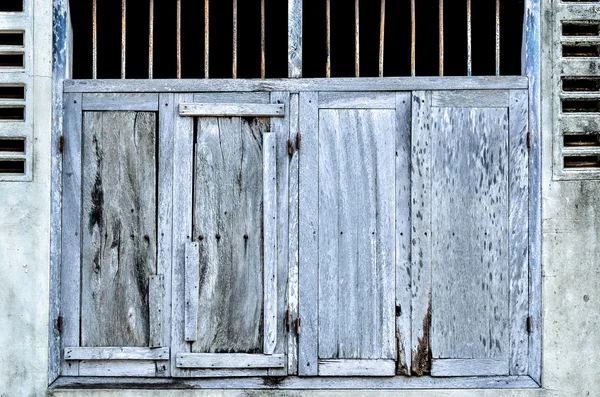 Old blue wooden window at ancient building — Stock Photo, Image