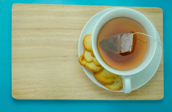 Hot Earl Grey Tea with Crispy Bread on Wooden Board With space for place your message.