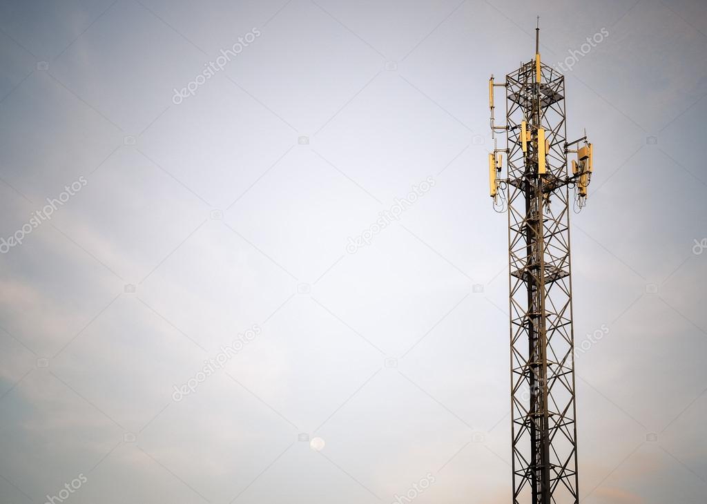 Communication tower or Telecoms cell phone tower  in early morning