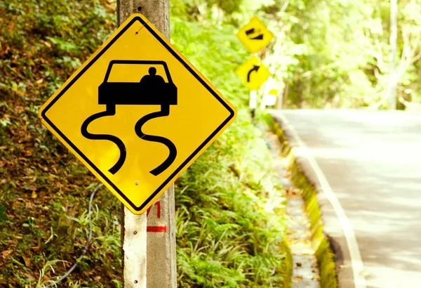 Caution - traffic signs beside country road — Stock Photo, Image
