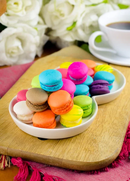 Colorful macarons on white plate — Stock Photo, Image