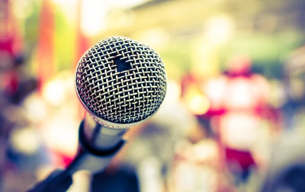 Old microphone in front of colorful background — Stock Photo, Image