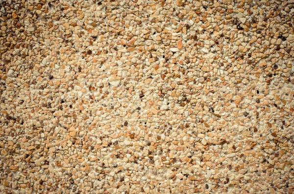 Cement falfelület borított kövek — Stock Fotó