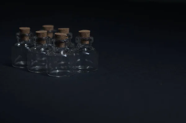 Tiny Ampoules Corks Black Background — Stock Photo, Image