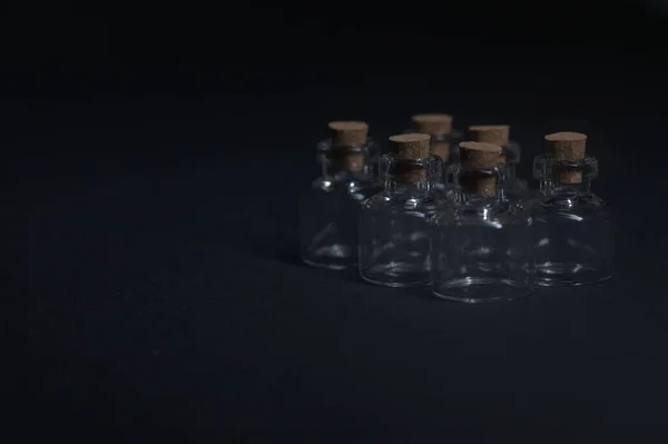 Tiny Ampoules Corks Black Background — Stock Photo, Image