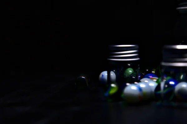 Jar Colored Marbles Black Surface — Stock Photo, Image