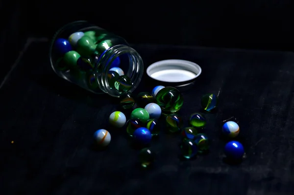 Jar Colored Marbles Black Surface — Stock Photo, Image