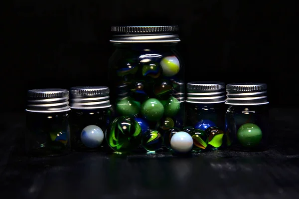 Jar Colored Marbles Black Surface — Stock Photo, Image