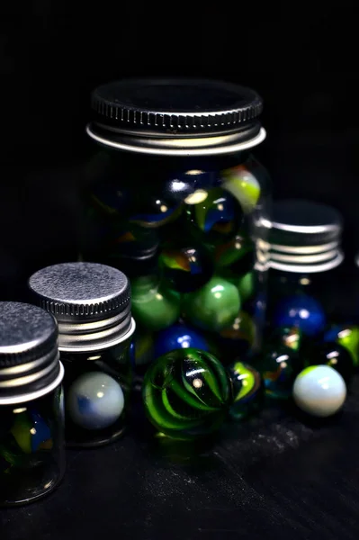 Jar Colored Marbles Black Surface — Stock Photo, Image