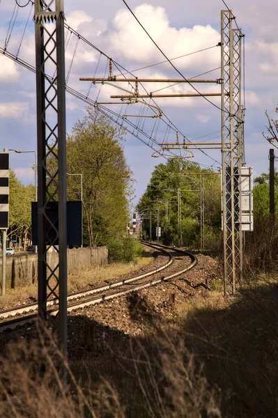 Rail crossing in an italian town on a cloudy day