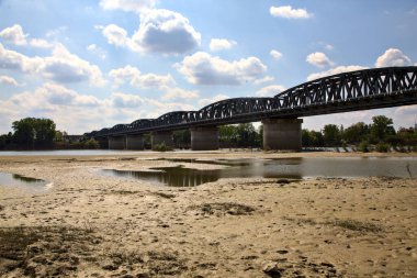 Railway bridge on a dried river in the italian countryside in spring