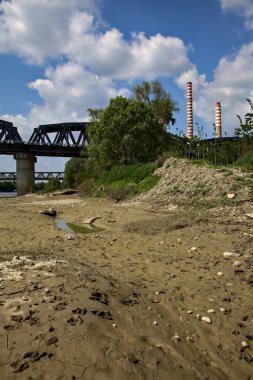 Railway bridge on a dried river in the italian countryside in spring
