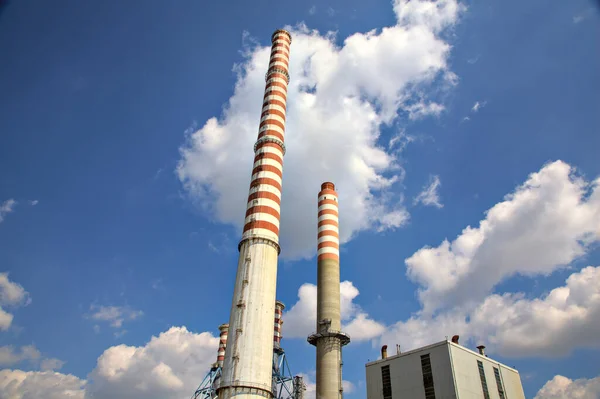Smokestacks with a clear sky as backdrop