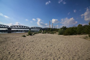 Railway bridge on a dried river in the italian countryside in spring