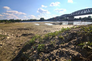 Railway bridge on a dried river in the italian countryside in spring