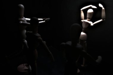 Duvara dayanmış umutsuzluğa kapılmış mankenler çiziyor.