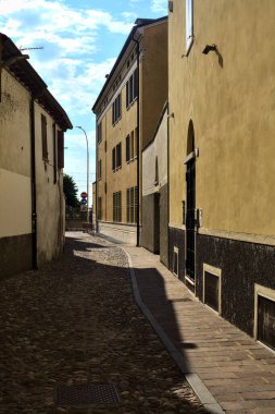 Alley in the shade at sunset in summer in an italian town