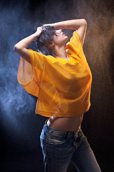 Young wet dirty sexy woman with yellow football shirt — Stock Photo, Image