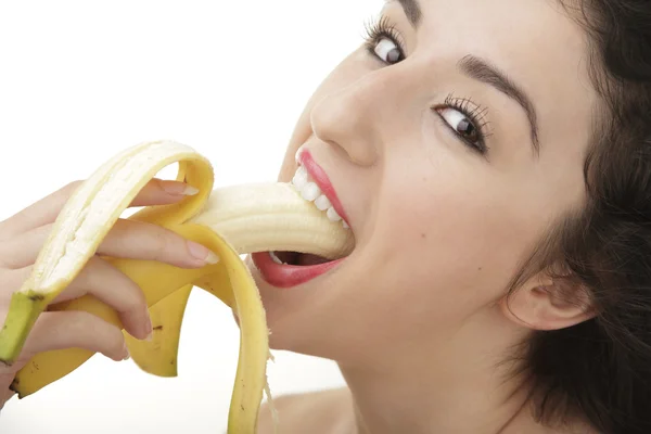 Bella donna sexy mangiare banana — Foto Stock