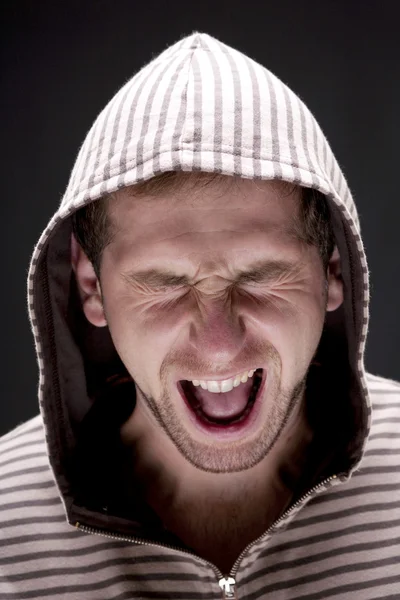 Angry man with hood screaming — Stock Photo, Image