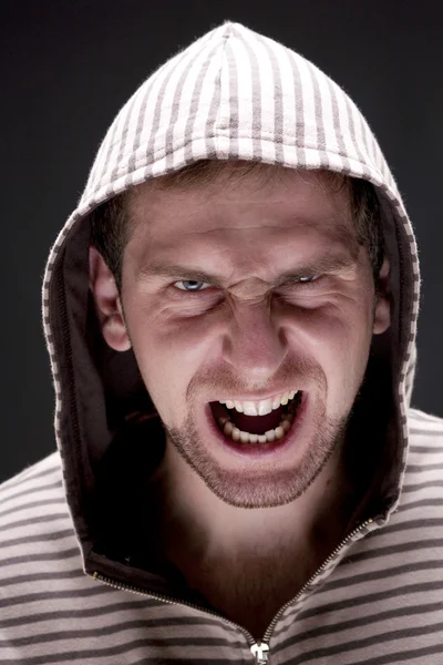 Angry man with hood screaming — Stock Photo, Image