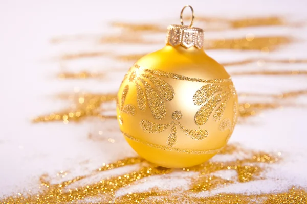 Golden Christmas toy whit handmade decoration. Spilled glitter — Stock Photo, Image