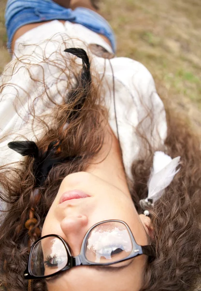 Beautiful hippie girl with glasses in the park — Stock Photo, Image