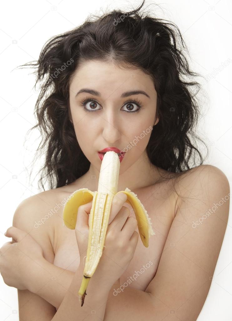 Beautiful sexy woman eating banana