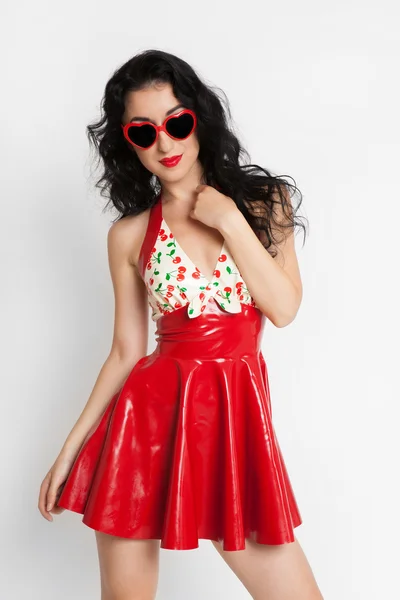 Sexy woman in red latex dress with sunglasses — Stock Photo, Image